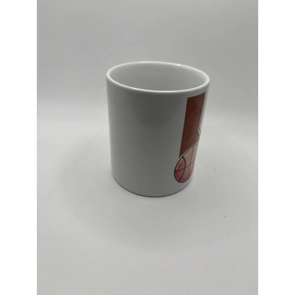 Very Unique Basketball Coffee Mug handle is the arm dunking basketball